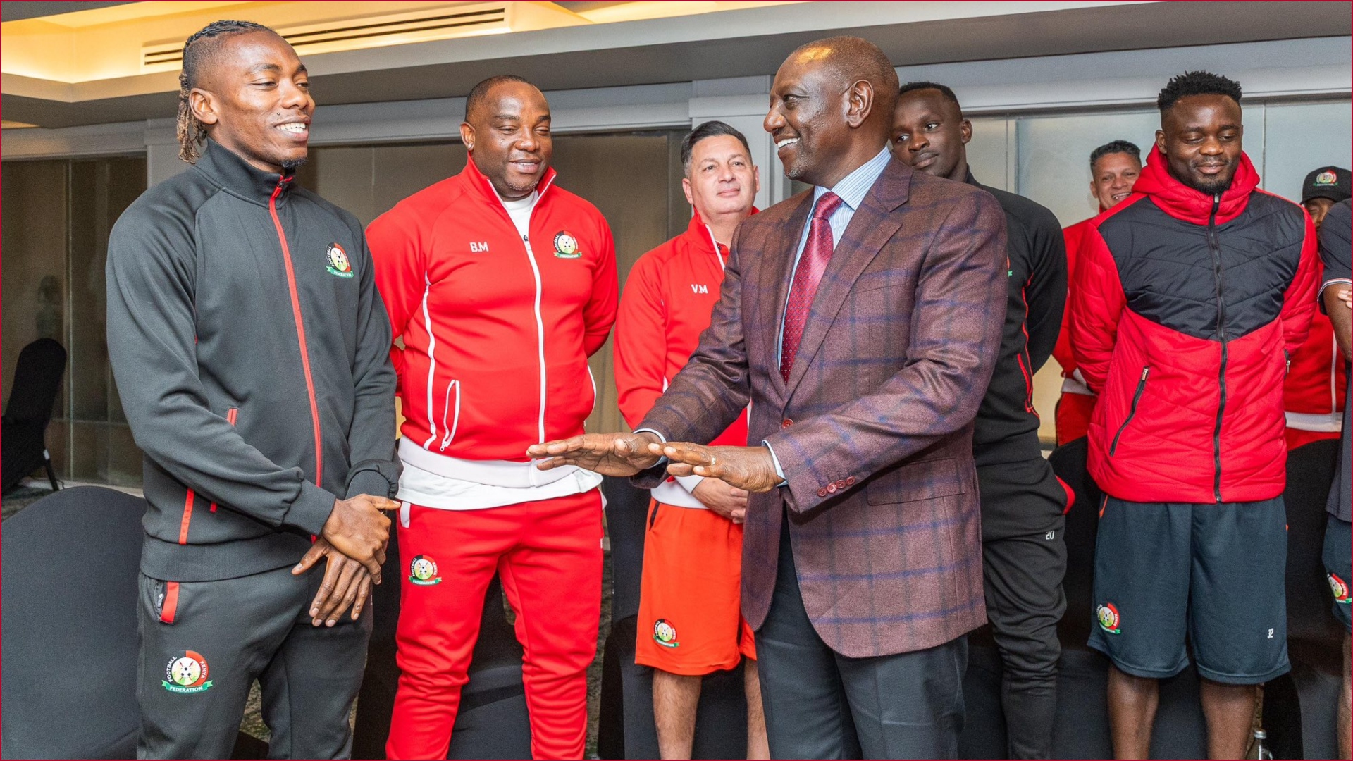 President William Ruto sharing a moment with Harambee Stars players.